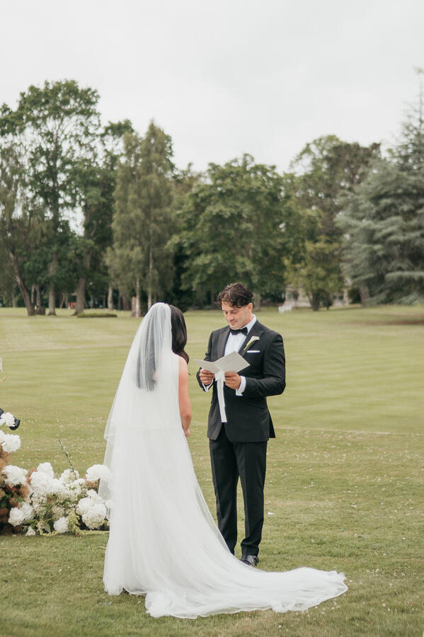 Outdoor Wedding Ceremony Bride and groom standing together during their romantic outdoor wedding ceremony in Scotland.